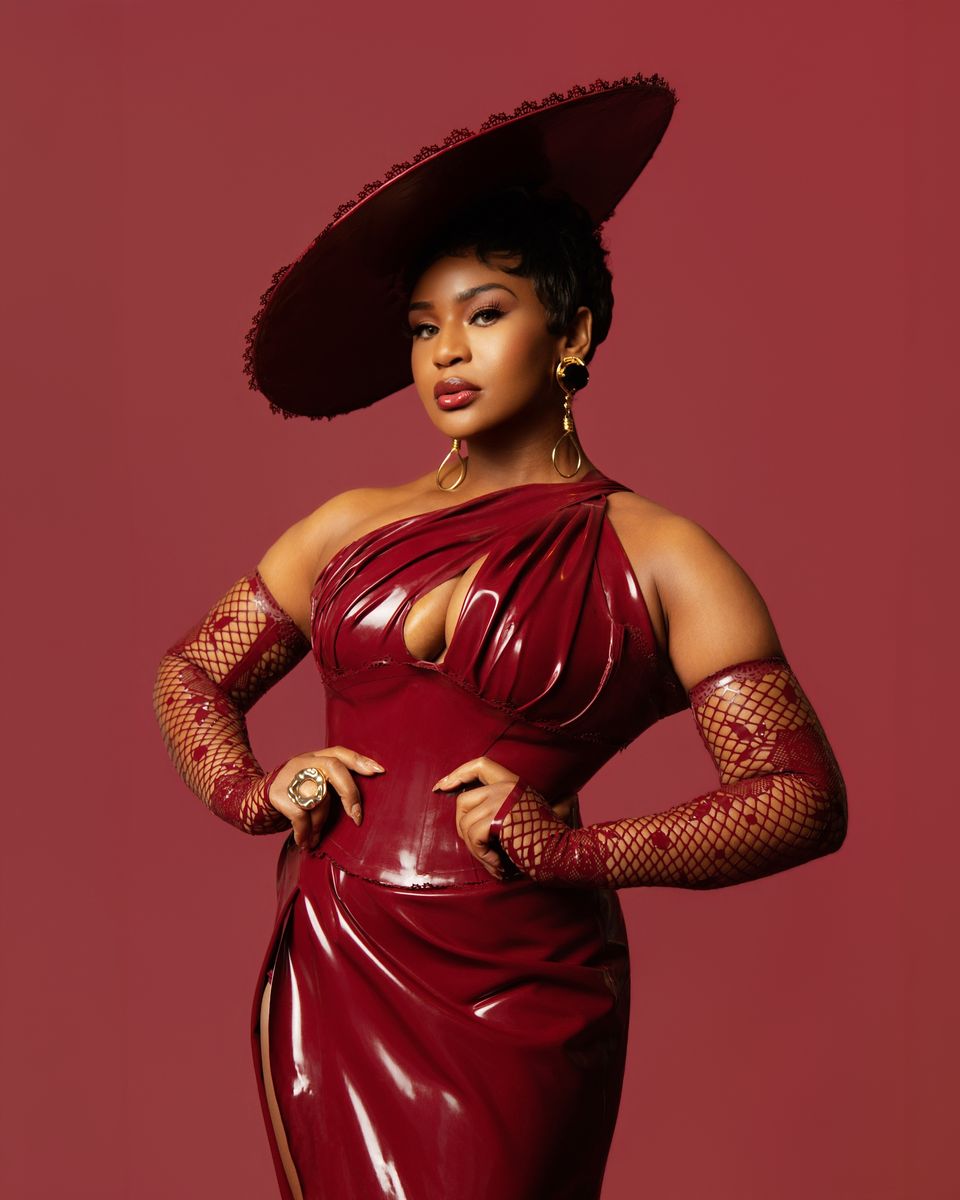 Oxblood latex gown and wide hat